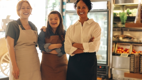 Three women working in a market