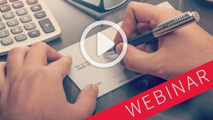 a play button and the word "webinar" superimposed over a pair of hands writing a check