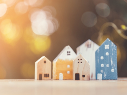 a cluster of small wooden houses painted in bright colors