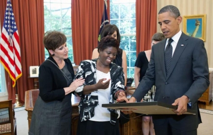 Lois Curtis Presenting President Obama with a painting